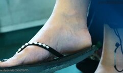 Dangling flip flops, nice feet close-up