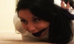 Gina Rae hogtied with palms facing out and gagged with a big ball inside a stocking!