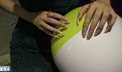 Nails scratching, puncture and destroying beach balls