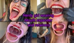 Nerdy girl wearing mouth expander and retainers