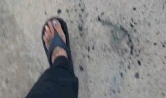 Avi Lola walks in flip flops wiggling her toes and crushing random things in her path