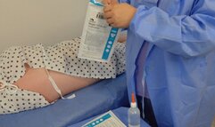 Patient receives kinky enema from surgical nurse