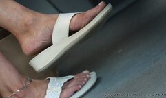 Beauty mature woman feet with open sandals dangling, candid foot fetish watching