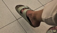 Really dangling birkenstock slippers in doctor's office
