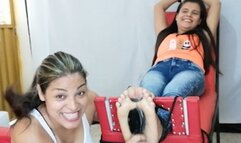 Karol is tickled while tied in the stocks