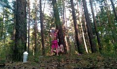 Domina Evgenia - a slave tied to a tree sucking my strapon and eating my ashes