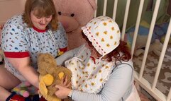 Diaper girls makeout and wand each other in the crib