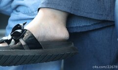 Candid big feet in slippers and shoes on train seat with shoeprint