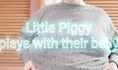 Little Piggy plays with their belly