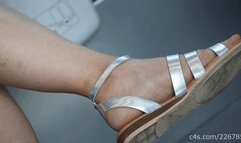 Beauty girl in sandals with pretty feet and legs, candid foot fetish