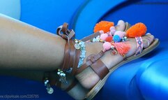 Rude girl with beauty feet puts her dirty colored sandal on train seat, candid foot and shoe fetish