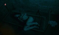 Tattoo-Girl bound to a bedframe to feel tickling, clamps and bastonade