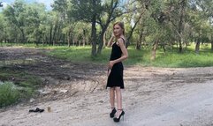 sexy hot girl in high heels walking in deep and slippery mud