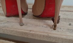 Kat Sinks Her Sharp Louboutins into a Wooden Pallet
