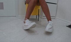 toe wiggling in white soft sneakers c