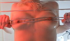 Nipple pinching girl screams from pinching her tits with rods