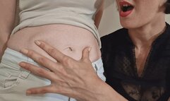 A petite woman with a huge belly button