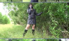 Mistress Angela smokes in purple leather gloves and coat