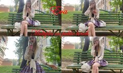 Eva smokes multiples on public bench