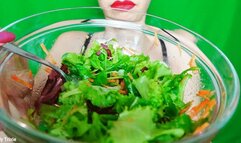 chewing and eating colorful salad