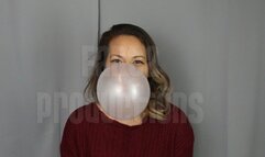 Jane Domino Blowing Bubbles in Red Sweater