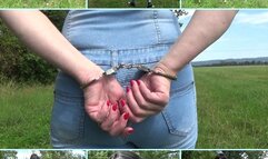 Handcuffed walk in a jeans jumpsuit