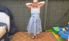 striptease in 50s blue dress with nylon stockings and suspenders