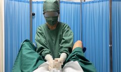 Asian doctor in surgical gown gives handjob with male organ and dildo
