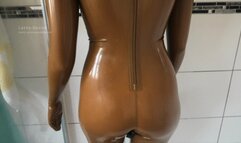 Taking off the sweaty golden rubber doll suit