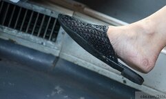 candid dangling dirty feet with slippers moving the foot nervously