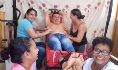 8 hands tickle a boy