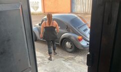 Barbara takes the VW Beetle out for a Sunday drive in flip flips and dark pantyhose