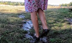 Walks through the mud and washes his feet in the stream