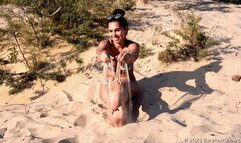 Beautiful Olivia shows off her huge feet on a public beach (Part 1 of 2)