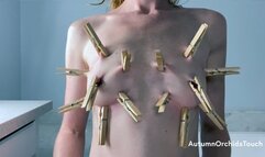 Clothes pin masochistic breast play