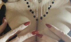 Playing with my boobies.