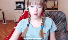 Pigtailed coed likes to show off her tits and she is proud of her long tongue