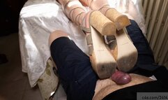 Girl rest her sandals on men cock while shie is in realxing on sofa