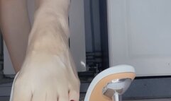 Aesthetics of white sandals with sharp iron heels and tasks for a foot slave