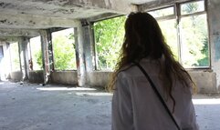 A red-haired young woman rides naked on a skipping rope.