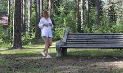 Redhead young woman naked in the park