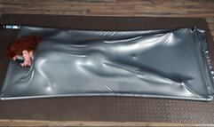 Orgasms butt up in a gray latex bed