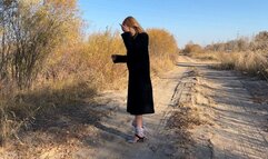 girl with tied legs in high heels tries to run away to hide, she falls, tries to jump, takes off her shoes and jumps barefoot