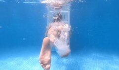 Lee Von Lux kicks her legs back and forth from behind