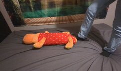 Sanda is crushing a big plushie with socks