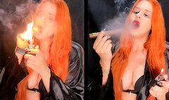 Sucking a cigar with my red lips and wearing a satin robe