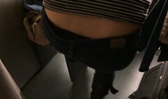 Trying on jeans in a store