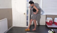 Katie Stepping On Oranges With Her Bare Feet