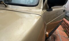 Karlotta Cranking the Fiat to go to the mall in low cut blouse, dress pants and heels