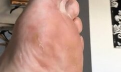 Bare feet slow and slightly dirty